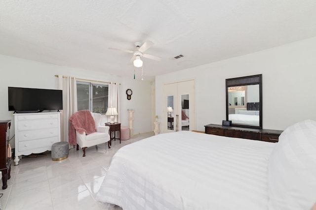 12611 Bexhill Dr, Houston, TX 77065 - bedroom featuring a ceiling fan and light marble finish floors