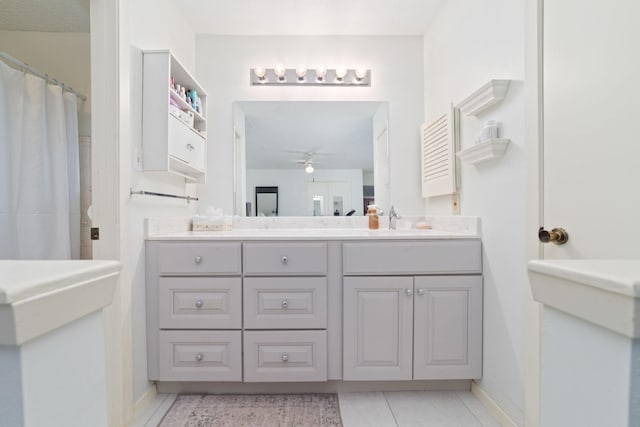 12611 Bexhill Dr, Houston, TX 77065 - bathroom with a ceiling fan, vanity, and tile patterned flooring