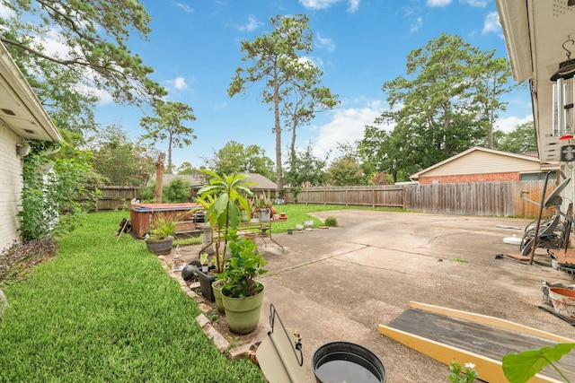 12611 Bexhill Dr, Houston, TX 77065 - fenced backyard featuring a hot tub and a patio area
