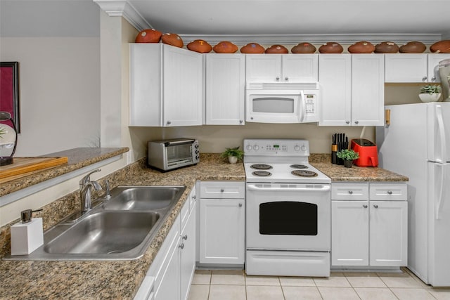 1725 Harvey Mitchell Pkwy S Unit 2234, College Station, TX 77840 - kitchen with white appliances, white cabinets, and light tile patterned floors