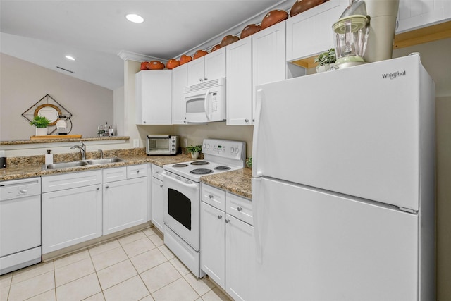 1725 Harvey Mitchell Pkwy S Unit 2234, College Station, TX 77840 - kitchen featuring white appliances, light tile patterned floors, white cabinets, and recessed lighting