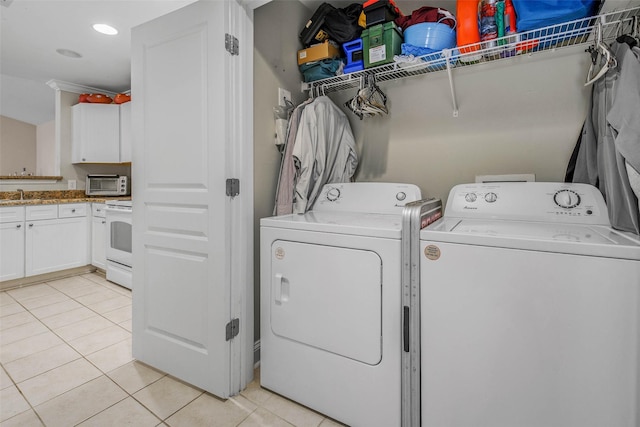 1725 Harvey Mitchell Pkwy S Unit 2234, College Station, TX 77840 - laundry area featuring separate washer and dryer, light tile patterned floors, and recessed lighting