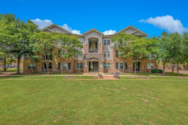 1725 Harvey Mitchell Pkwy S Unit 2234, College Station, TX 77840 - view of front of home featuring a front lawn and brick siding