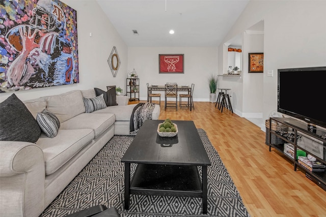 1725 Harvey Mitchell Pkwy S Unit 2234, College Station, TX 77840 - living room featuring wood finished floors, vaulted ceiling, and recessed lighting