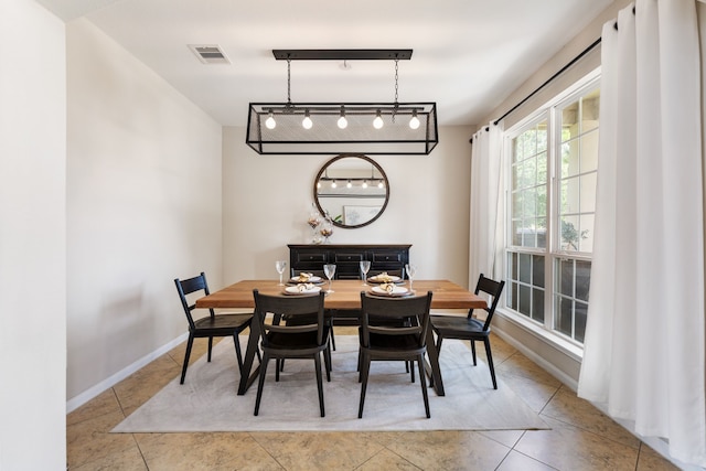 20314 Tarpon Bay Ln, Cypress, TX 77433 - tiled dining space with rail lighting and baseboards