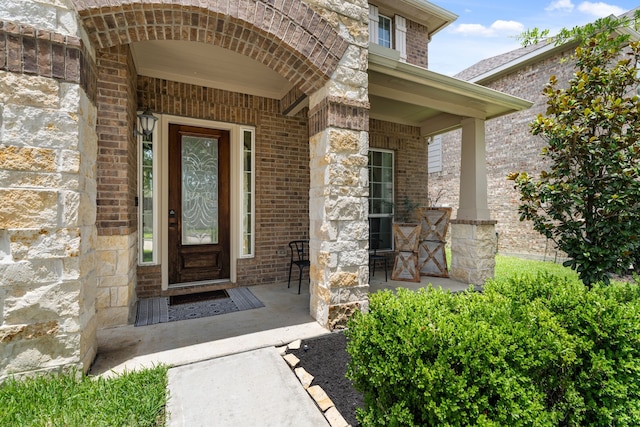 20314 Tarpon Bay Ln, Cypress, TX 77433 - doorway to property featuring brick siding, stone siding, and a porch