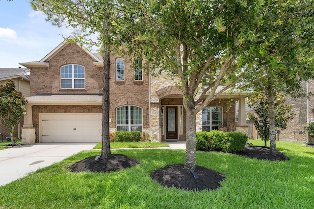 20314 Tarpon Bay Ln, Cypress, TX 77433 - view of front of house with a front lawn, driveway, brick siding, and an attached garage