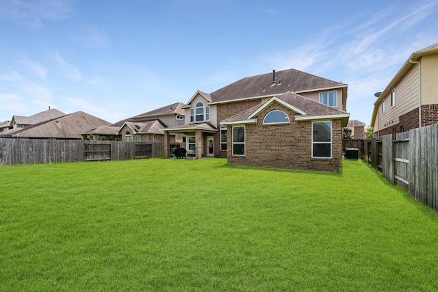 20314 Tarpon Bay Ln, Cypress, TX 77433 - rear view of property featuring a fenced backyard, brick siding, and a shingled roof