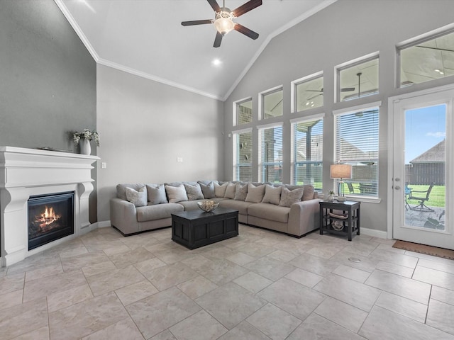4623 Bisontine Bay Ln, Rosharon, TX 77583 - living room with crown molding, a ceiling fan, a glass covered fireplace, and high vaulted ceiling