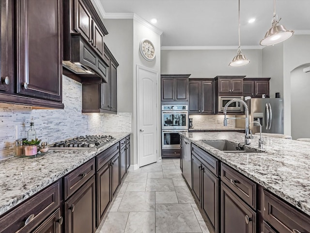 4623 Bisontine Bay Ln, Rosharon, TX 77583 - kitchen featuring stainless steel appliances, ornamental molding, arched walkways, dark brown cabinets, and backsplash