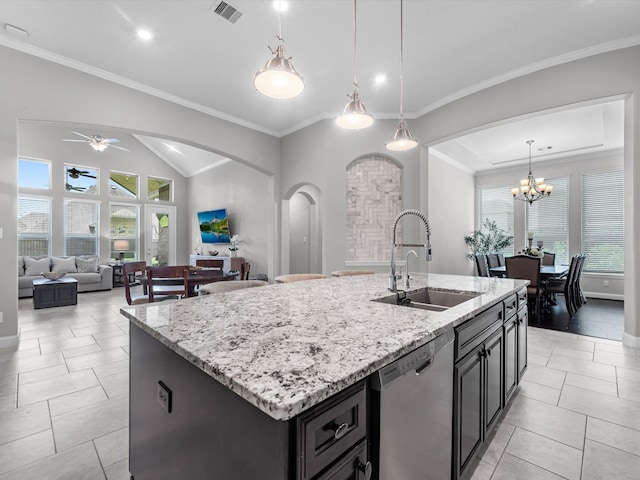 4623 Bisontine Bay Ln, Rosharon, TX 77583 - kitchen featuring stainless steel dishwasher, arched walkways, light stone countertops, a kitchen island with sink, and recessed lighting