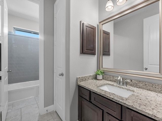 4623 Bisontine Bay Ln, Rosharon, TX 77583 - bathroom featuring vanity, marble look tile flooring, and washtub / shower combination