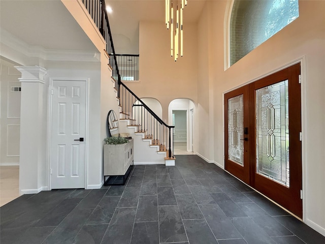 19 Pebble Hollow Ct, The Woodlands, TX 77381 - foyer with stairway, plenty of natural light, arched walkways, and a towering ceiling