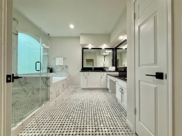 19 Pebble Hollow Ct, The Woodlands, TX 77381 - bathroom with vanity, a garden tub, a marble finish shower, and recessed lighting