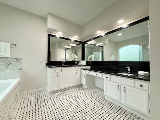 19 Pebble Hollow Ct, The Woodlands, TX 77381 - full bath with double vanity, a walk in shower, a garden tub, and recessed lighting
