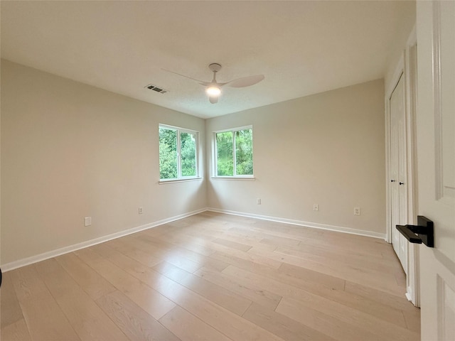 19 Pebble Hollow Ct, The Woodlands, TX 77381 - empty room with ceiling fan and light wood-style flooring
