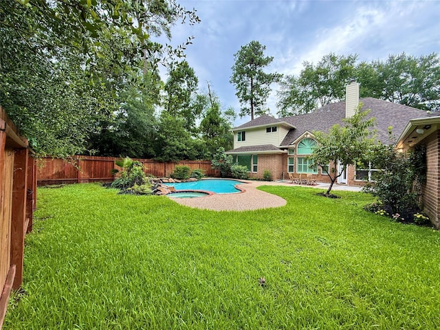 19 Pebble Hollow Ct, The Woodlands, TX 77381 - fenced backyard with a patio area and a pool with connected hot tub