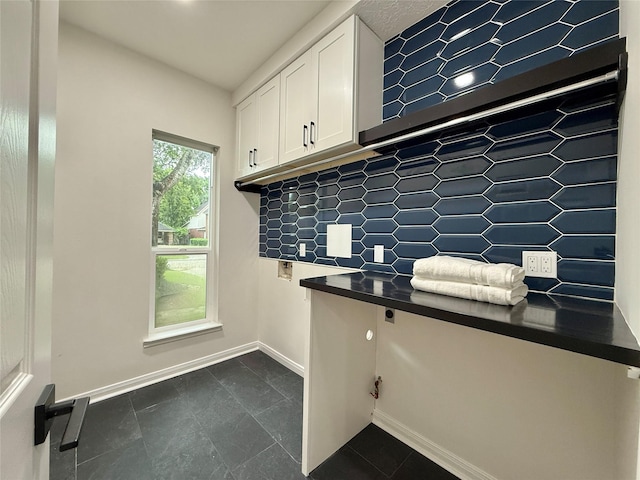 19 Pebble Hollow Ct, The Woodlands, TX 77381 - unfurnished office featuring baseboards and dark tile patterned floors