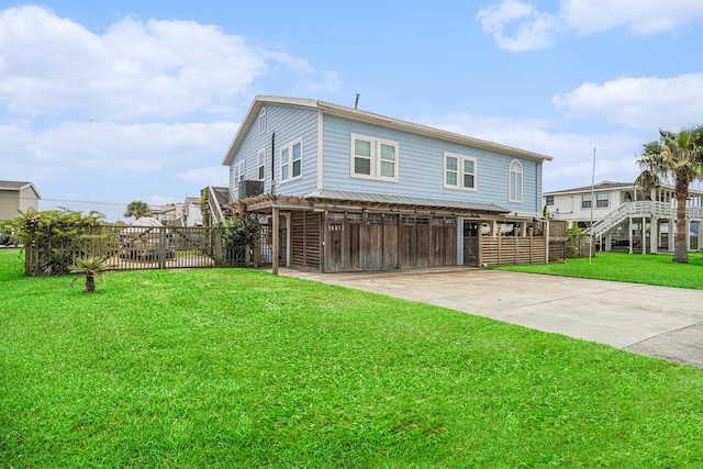 16615 Mansvelt Rd, Jamaica Beach, TX 77554 - view of front of property featuring concrete driveway and a carport