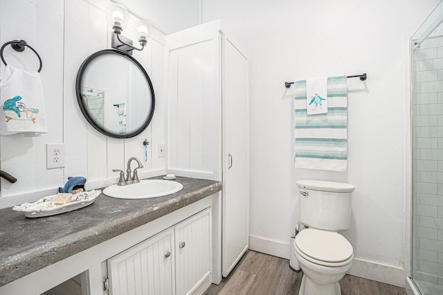 16615 Mansvelt Rd, Jamaica Beach, TX 77554 - bathroom with wood finished floors, vanity, and a tile shower