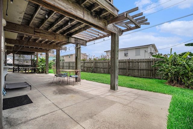 16615 Mansvelt Rd, Jamaica Beach, TX 77554 - fenced backyard with a pergola, a patio area, and outdoor dining space