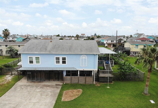 16615 Mansvelt Rd, Jamaica Beach, TX 77554 - view of front facade featuring a residential view, driveway, and stairway