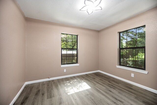 300 Duncan Ave, Lufkin, TX 75901 - empty room with wood finished floors and baseboards