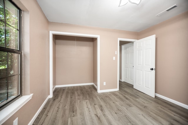 300 Duncan Ave, Lufkin, TX 75901 - unfurnished bedroom with wood finished floors and a closet