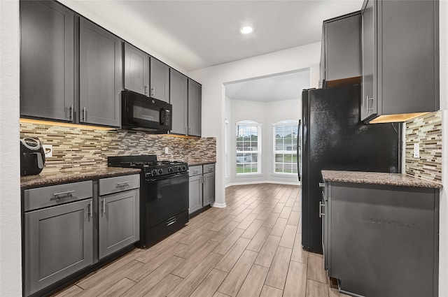 11346 Cascading Stream Way, Houston, TX 77044 - kitchen featuring black appliances, backsplash, light wood-style flooring, recessed lighting, and gray cabinetry