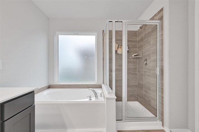 11346 Cascading Stream Way, Houston, TX 77044 - full bath with a stall shower, a bath, and vanity