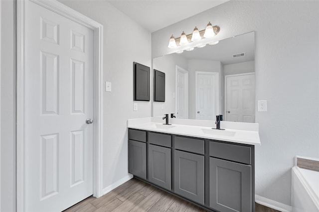 11346 Cascading Stream Way, Houston, TX 77044 - full bath featuring double vanity and wood finished floors