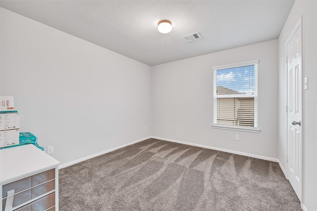 11346 Cascading Stream Way, Houston, TX 77044 - unfurnished bedroom featuring carpet flooring and a textured ceiling