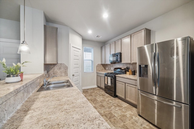 2322 Honey Heights Ln, Fresno, TX 77545 - kitchen with black appliances, decorative backsplash, light countertops, stone finish floors, and recessed lighting