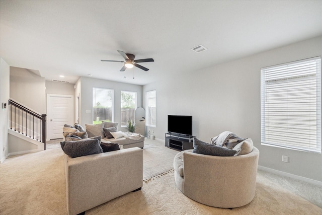 2322 Honey Heights Ln, Fresno, TX 77545 - living area with carpet flooring, a ceiling fan, and stairway