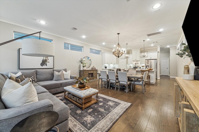 5240 Larkin St, Houston, TX 77007 - living room with crown molding, a chandelier, dark wood finished floors, and recessed lighting