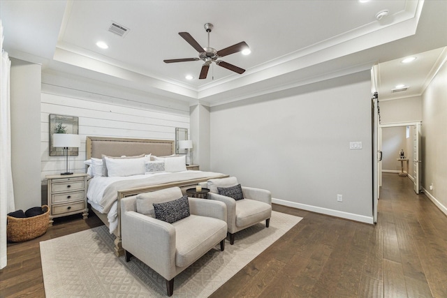 5240 Larkin St, Houston, TX 77007 - bedroom featuring a tray ceiling, crown molding, dark wood-style flooring, ceiling fan, and recessed lighting