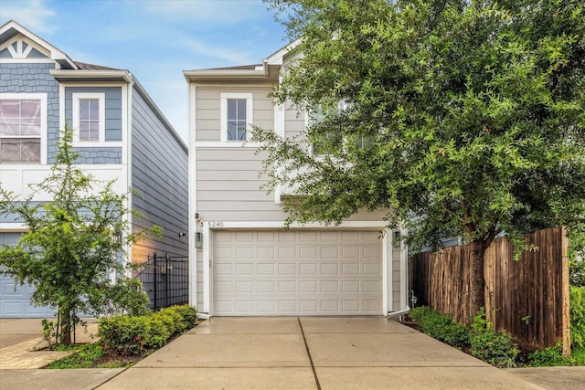 5240 Larkin St, Houston, TX 77007 - view of front facade with an attached garage and driveway