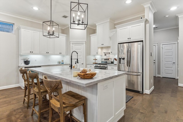 5240 Larkin St, Houston, TX 77007 - kitchen with stainless steel appliances, dark wood-style flooring, white cabinets, decorative backsplash, and crown molding