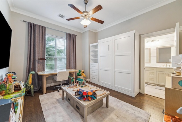5240 Larkin St, Houston, TX 77007 - playroom with an office area, wood finished floors, a ceiling fan, and crown molding