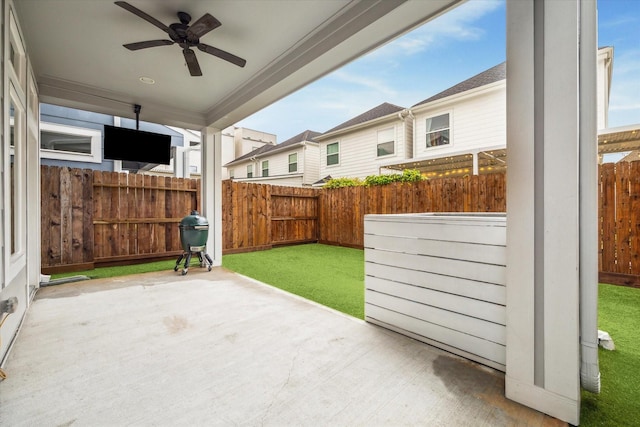 5240 Larkin St, Houston, TX 77007 - fenced backyard with ceiling fan, a grill, and a patio