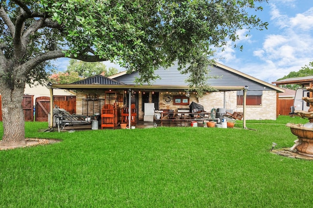 37 Wagon Lane Loop, Angleton, TX 77515 - back of property with a patio area