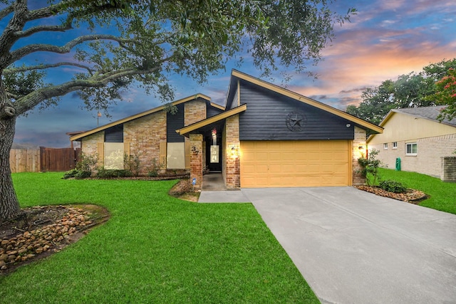 37 Wagon Lane Loop, Angleton, TX 77515 - mid-century home with an attached garage, brick siding, and concrete driveway