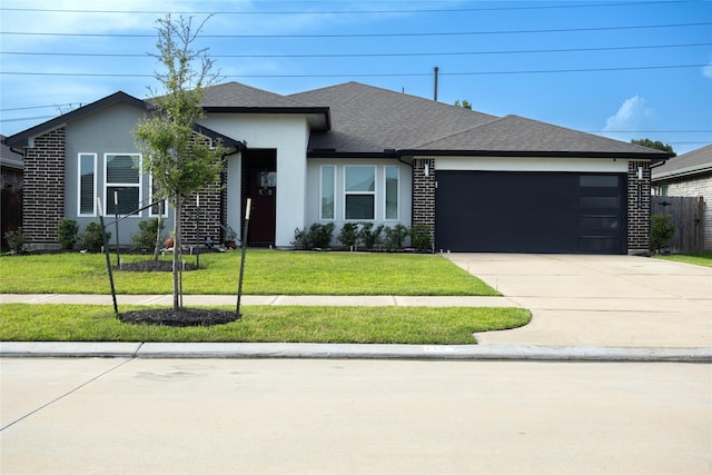 1126 Hyde Lake Ln, Missouri City, TX 77459 - ranch-style home featuring a garage, concrete driveway, a front lawn, a shingled roof, and stucco siding