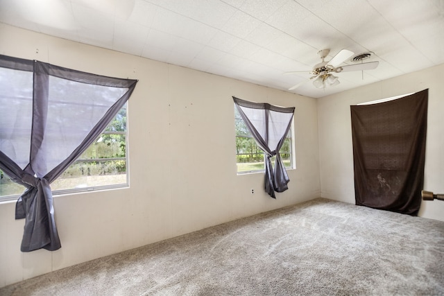 423 Pouland St, Zavalla, TX 75980 - carpeted spare room with healthy amount of natural light and a ceiling fan