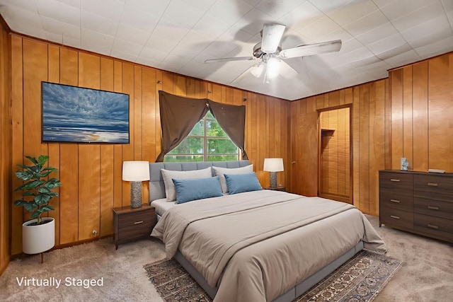 423 Pouland St, Zavalla, TX 75980 - bedroom featuring light carpet, wood walls, and ceiling fan