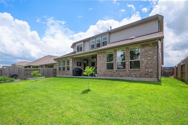 3447 Warwick River Trl, Kingwood, TX 77365 - rear view of house with ceiling fan, a fenced backyard, and brick siding