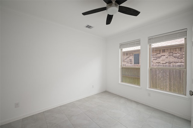 3447 Warwick River Trl, Kingwood, TX 77365 - spare room with crown molding, ceiling fan, and light tile patterned floors