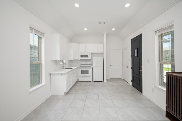 3447 Warwick River Trl, Kingwood, TX 77365 - kitchen featuring white appliances, light countertops, white cabinetry, crown molding, and recessed lighting