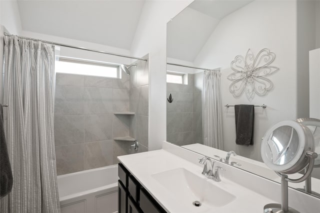 3447 Warwick River Trl, Kingwood, TX 77365 - bathroom featuring vaulted ceiling, shower / bath combo with shower curtain, vanity, and plenty of natural light