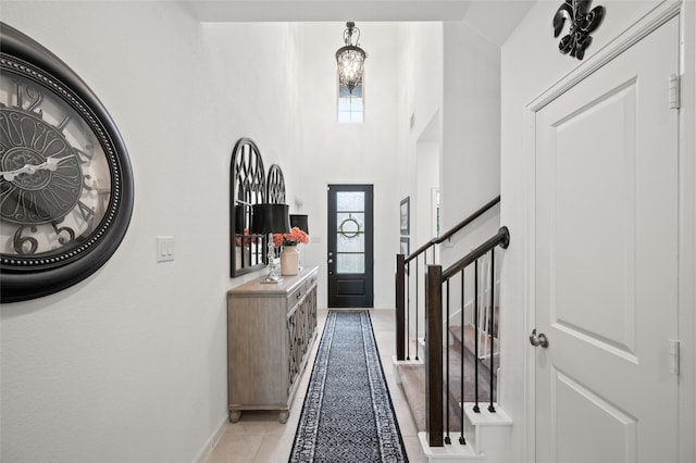 3447 Warwick River Trl, Kingwood, TX 77365 - foyer featuring light tile patterned flooring and stairway